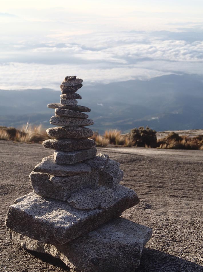 Delicately laid rock cairn on the summit trail.